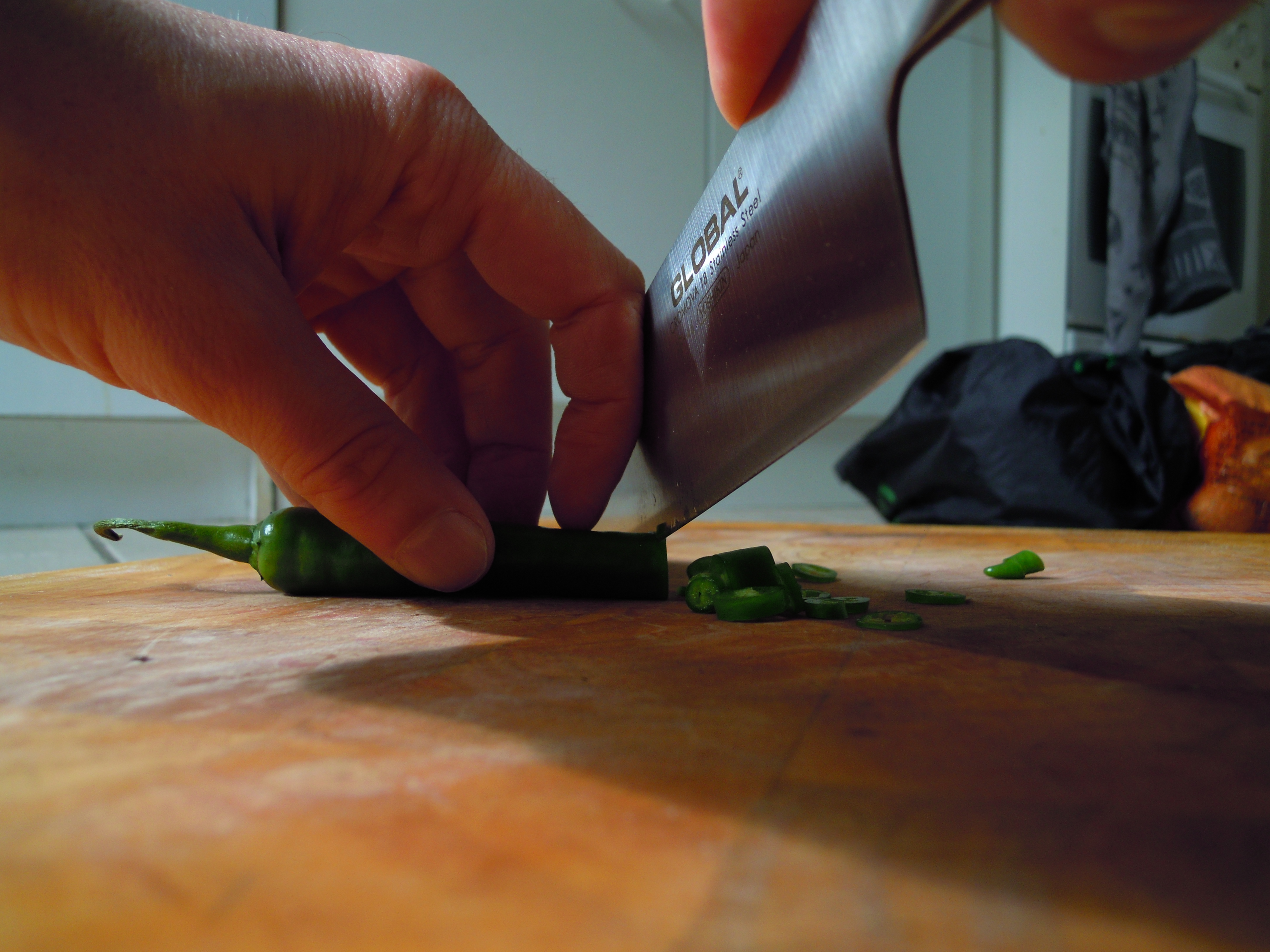 Image of a chef chopping ingredients.